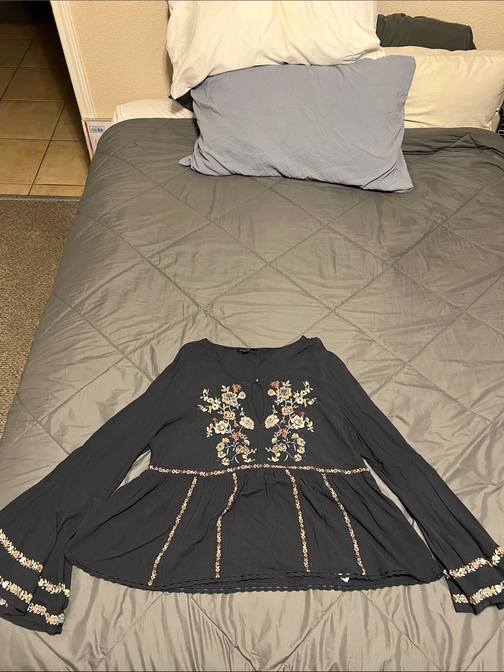 Embroidered Black Peplum Blouse with Floral Accents